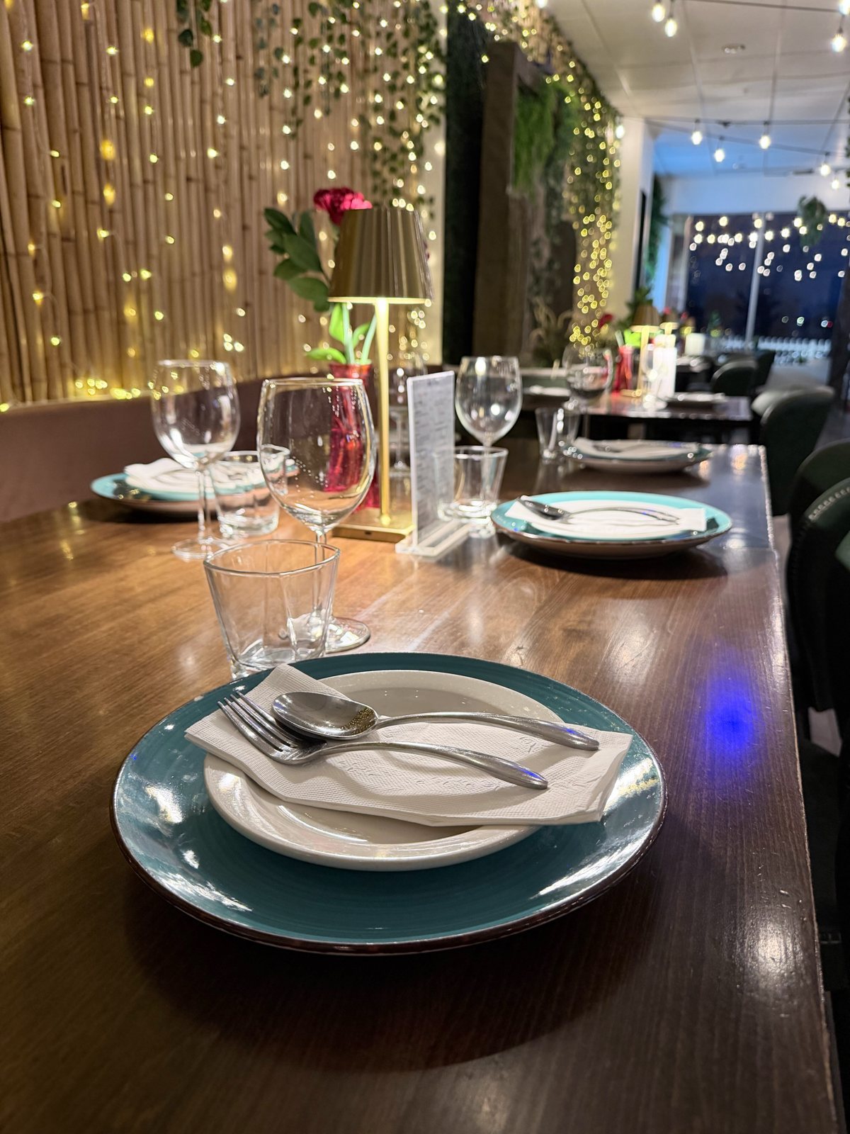 Main dining room set under fairy lights