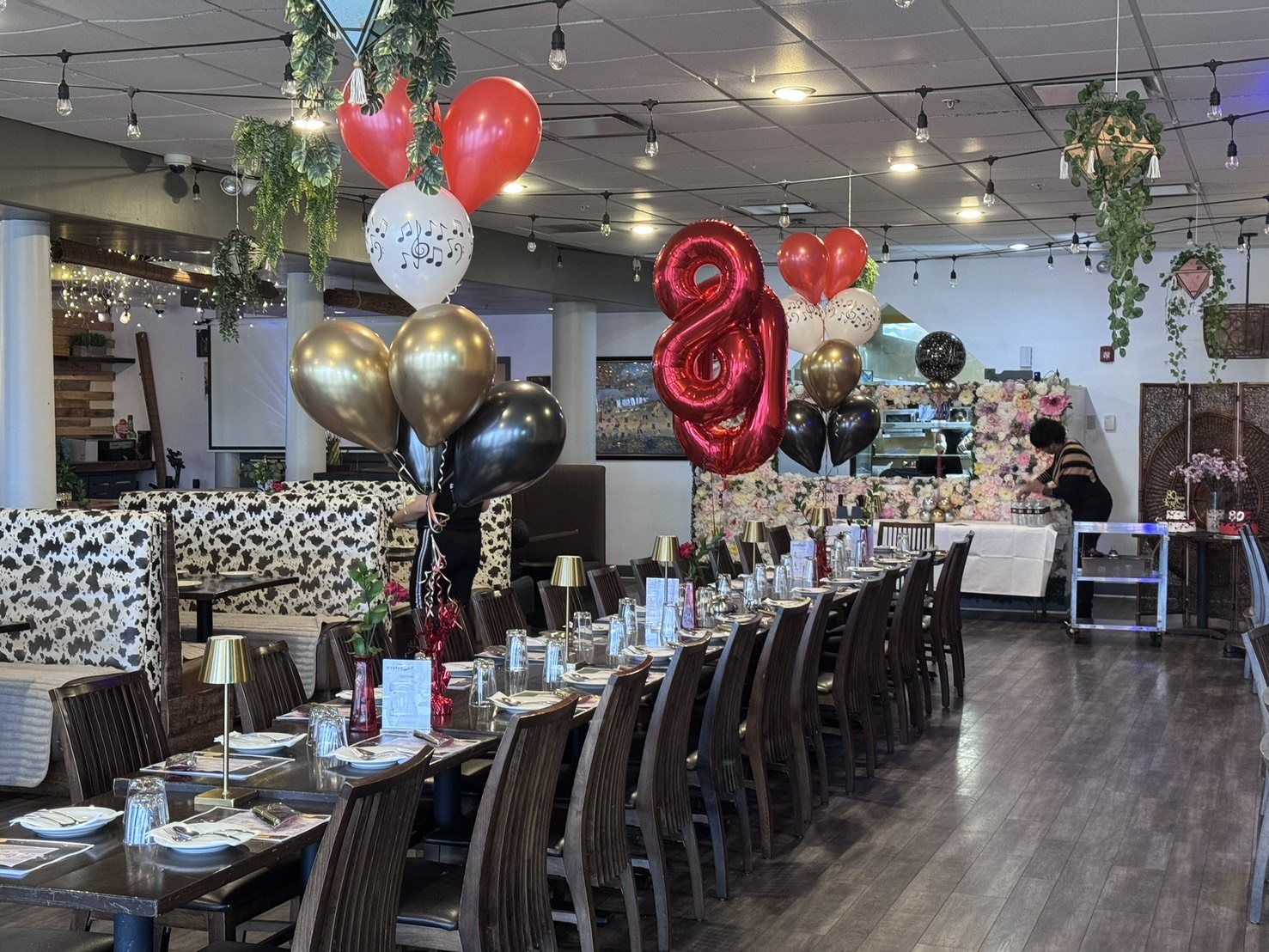 Celebration tables and bar with balloons